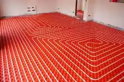 Image of underfloor heating installation exposed at a construction site.