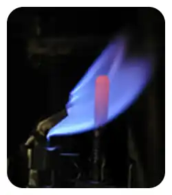 Pilot flame lit in an old gas boiler.